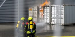 Containers with batteries on fire
